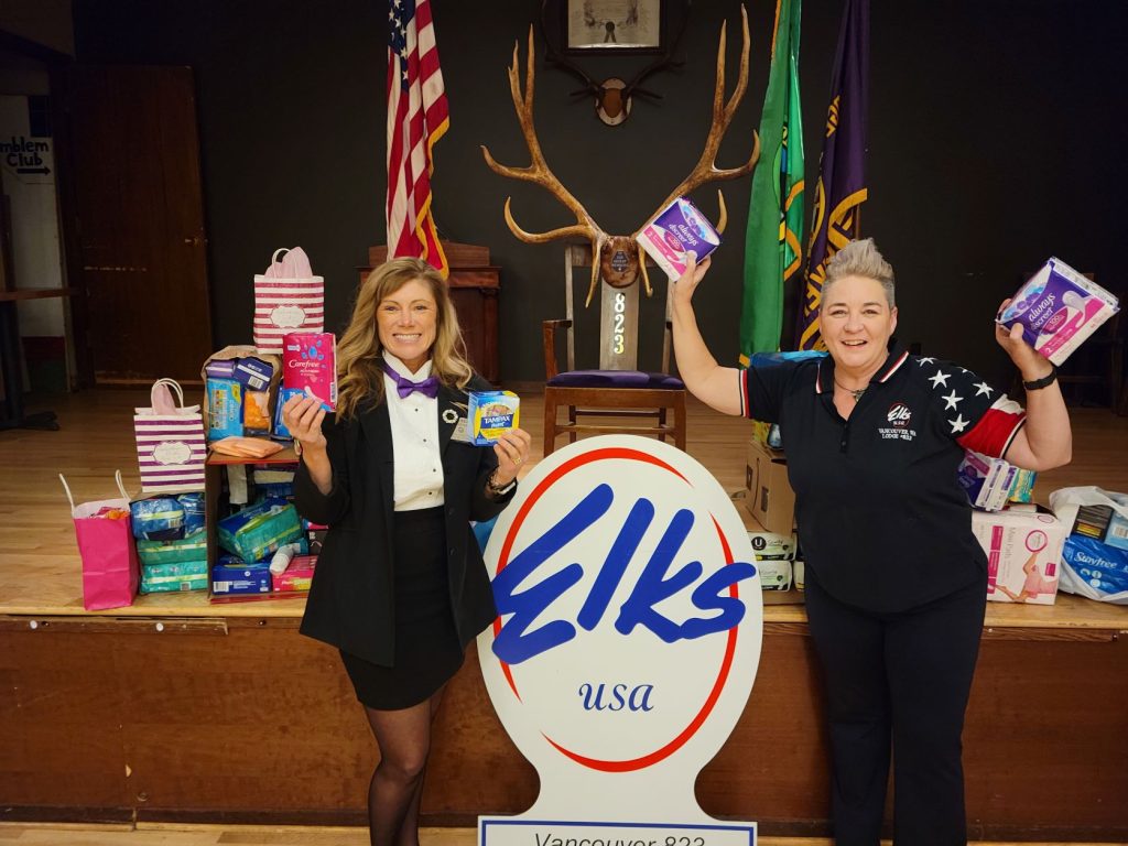 Two members of Vancouver Elks #823 with their Galentine's event donations